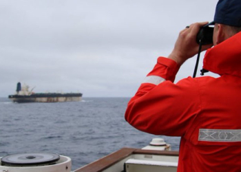 US Forces Seize Sanctioned Oil Tanker As Russian Warship Escorts Just Watch