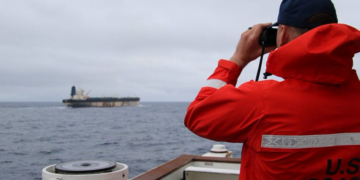 US Forces Seize Sanctioned Oil Tanker As Russian Warship Escorts Just Watch