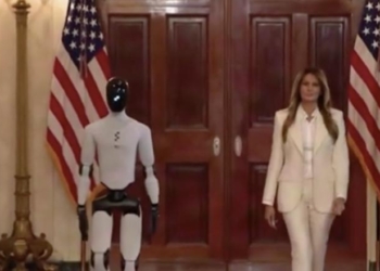 Watch Surreal Scene As Robot That Walks Like Joe Biden Disappears Behind Melania