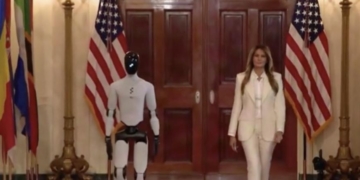 Watch Surreal Scene As Robot That Walks Like Joe Biden Disappears Behind Melania