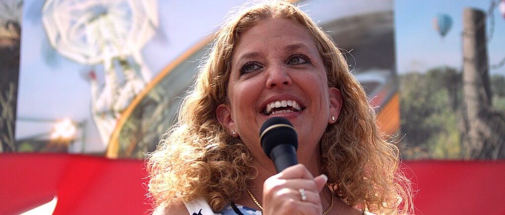 Debbie Wasserman Schultz Announces Run For Mainly Black District With Obama Poster In Background